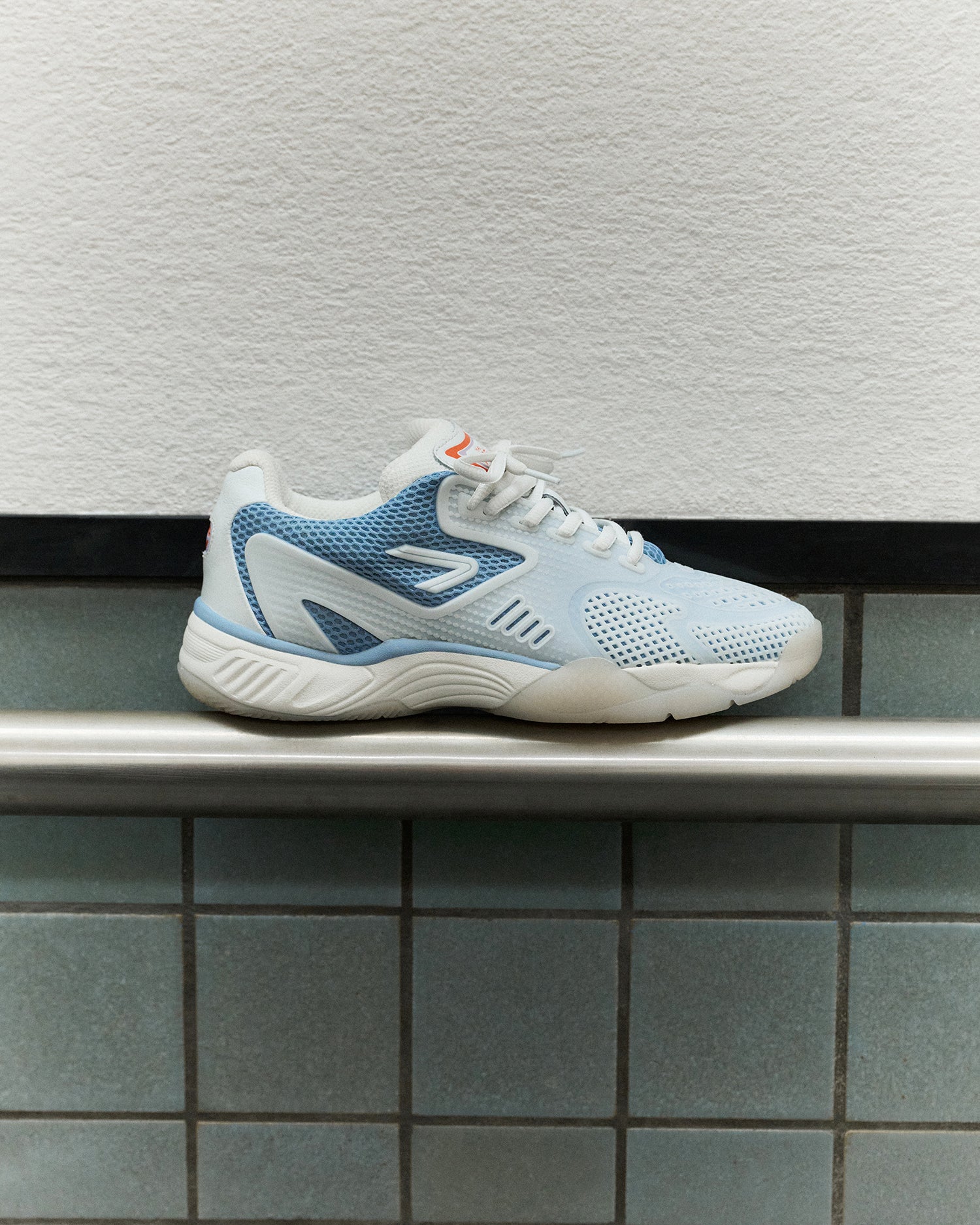 The ACE Hub OC sneaker in sea ice white, photographed at art museum in The Hague
